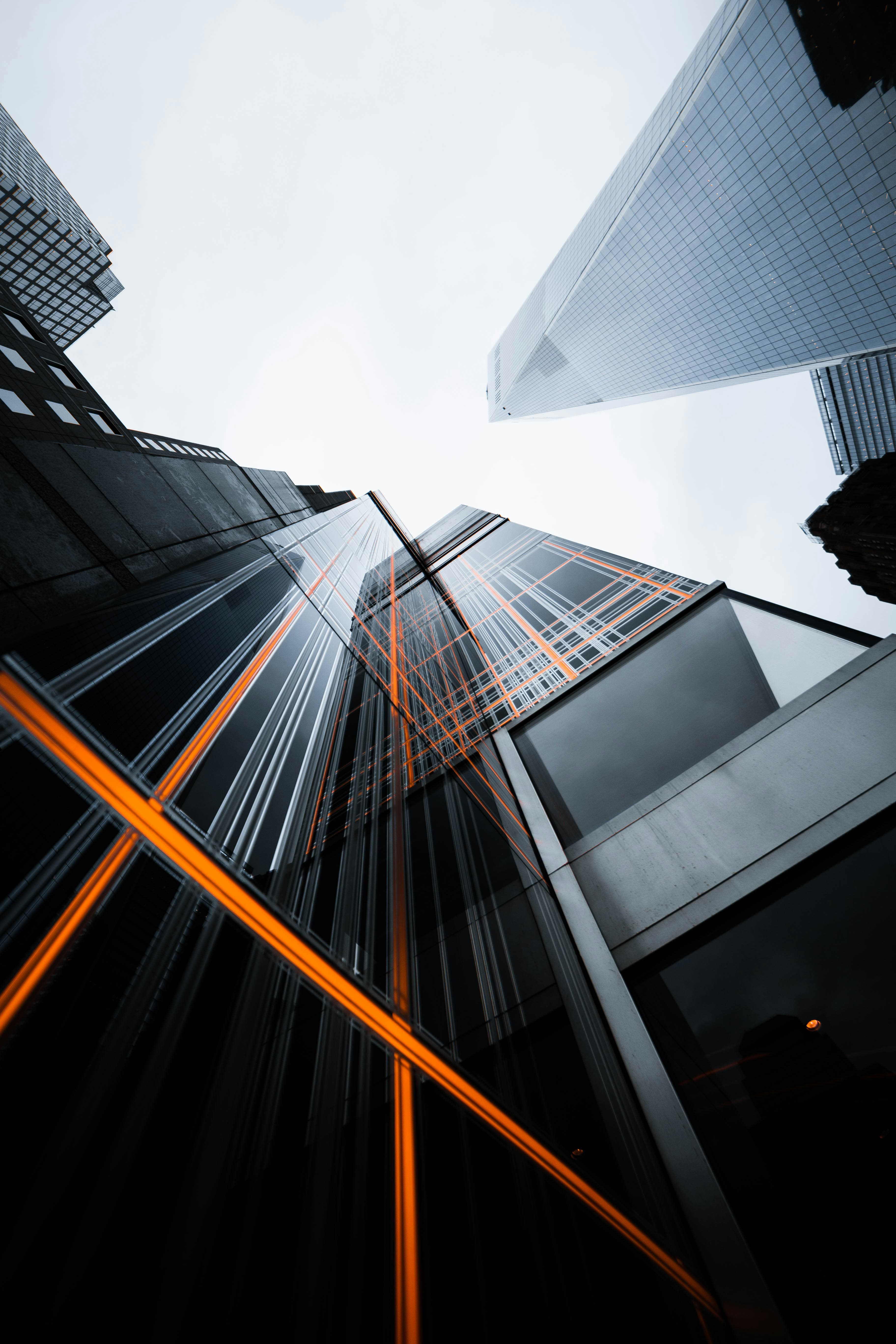 Looking up at glass skyscrapers, representing cloud and DevOps infrastructure
